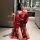 Woman in red ancient chinese court-style lingerie set with embroidered hanfu doudou and sheer flying skirt, posing in bathroo...