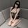 Woman modeling baiyueguang sheer mesh lingerie set with ruffled open-crotch chain detail and lace bralette.
