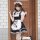 A stylish model poses in a classic black and white maid costume, featuring a ruffled apron with paw prints, perfect for kawai...