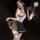 Woman in chao mu lace jk style lingerie set with sheer cup corset, butterfly bow, and maid-inspired skirt holding feather wan...