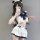 A stylish schoolgirl uniform set featuring a white top with navy blue accents, ruffled skirt, and playful bow details, perfec...