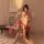 A woman elegantly poses wearing a sheer chinese silk lingerie set, featuring vintage-inspired hanfu elements like embroidered...