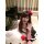 A woman poses playfully wearing a cute kitty cat maid costume set, featuring a black and white dress with pink accents and a ...