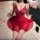 Woman wearing red fei niao moon gazing lingerie set — sheer lace sleep dress with open-crotch and rear exposure design, posed...
