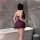Woman wearing feiniao moon gaze sexy sleepwear dress – sheer lace cami slip with ruffled hem, back view in modern bathroom.