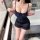 Woman wearing feiniao moon gaze sexy sleepwear dress – sheer navy lace cami slip with ruffled hem, posing in modern bathroom.