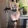 Woman wearing feiniao moon gazer lace bodysuit with sheer cut-outs, backless design, and black gloves.
