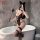 Woman in black lace feiniao moon gazer bodysuit with cat ears, posing by bathtub holding feather wand for valentine’s romance...