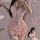 Woman wearing pink fengqu cat lace seductive lingerie dress with push-up corset, ruffles, and garter straps for bedroom play.