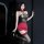 Woman modeling golden night sexy strapless lingerie set with black lace top, red skirt, and thigh-high stockings.