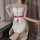 A woman poses wearing a glossy white nurse costume with red accents, featuring lace details and a heart emblem, perfect for c...