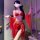 Exotic red silk flowy costume with tassel details, perfect for sensual allure and exotic vibes.