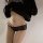 Sexy black lace bikini panties featuring sheer mesh design, low-rise style with seductive cut-out details for a bold look.