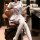 A woman sits elegantly in an office chair wearing a cute, alluring hannuoqu sexy jk uniform set. the outfit features a charmi...