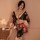 A woman poses elegantly in a japanese kimono-style lingerie set featuring a floral print, perfect for sensual photo shoots an...