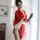 A woman elegantly poses in a red japanese kimono-style robe adorned with floral patterns, holding a fan, set for intimate rol...