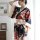 A woman models a japanese kimono-style robe set featuring floral patterns, perfect for role play and intimate nights.