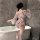 Woman wearing sheer floral japanese-style kimono lingerie set with open robe and matching bra brief in bathroom.