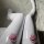 Shiny white leggings featuring cute pink cat paw patches, perfect for cosplay or adding a kawaii touch to any outfit.