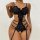 Woman wearing black luxury lace sheer bodysuit with intricate floral detailing and strappy design.