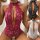Sheer lace lingerie set in red, black, and white with intricate floral patterns and deep neckline.