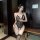 Woman wearing black lace temptation bodysuit with open-crotch design, sheer lace detailing, and matching thigh-high stockings...