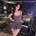 A stylish woman poses in a chic gray bodysuit from lemon story, perfect for date nights, car rides, or sleepwear. the no-remo...