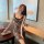 A woman elegantly poses wearing a leopard print lace chemise set, featuring sheer sleepwear and intimate lingerie designed fo...