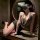 Woman posing in leopard print bodycon set with sheer chest-baring top and black shorts, styled as sexy sleepwear for curvy wo...