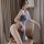 A woman poses elegantly in a long night seductive lingerie set, featuring a high-slit cheongsam style design. the outfit comb...