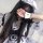 A woman wearing a maid costume cosplay outfit, featuring a cute anime lolita dress with ruffles and a white apron. perfect fo...