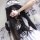 A woman wearing a maid costume cosplay outfit, featuring a cute anime lolita dress with white apron and headband, perfect for...