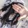 A woman wearing a maid costume cosplay outfit, featuring a cute anime lolita dress with black and white accents, perfect for ...