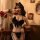 Sexy black feathered bodysuit with bow detail and thong back, part of mannye qing lingerie set for seductive wife style.