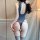 Woman wearing mannyqing seductive lace bodysuit, open-crotch romper in ice silk fabric, no-remove uniform style for bedroom p...