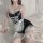 Sexy maid costume with lace details, black satin bodice and fishnet stockings, perfect for women seeking seductive sleepwear.