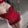 Seductive red sequined mini dress with halter neck design, perfect for festive celebrations.