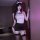 Woman in night charm alluring backless cutout bodycon lingerie set with white bow headband and garter stockings.