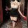 Woman in black-and-white night-silk seductive secretary outfit with lace garters, holding wine glass — sexy lingerie set & pu...