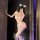 Woman in pink lace maid outfit with white cat ears, holding phone for mirror selfie. night silk sensual deep v lace maid outf...