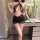 Woman wearing black lace and mesh night silk sensual bodycon mini dress with sheer panels, halter neckline, and ruffled hem.
