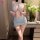 Woman modeling light blue night silk sensual sheer bodycon nightdress with chest cutout and backless design, standing beside ...