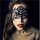 Woman wearing black lace blindfold mask from nightclub queen lingerie set, featuring intricate cut-out design for parties and...