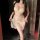 Woman wearing nightsigh lace babydoll dress with adjustable drawstring, sheer ultra-thin sleepwear for small bust.