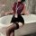 Woman in nightsigh nightseduce secretarial lingerie set – sleek burgundy top, tight black pencil skirt, thigh-high stockings,...