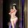 Woman in mirror selfie wearing nightsigh sexy nurse costume set with red trim, chest cutout bodysuit, tight skirt, and nurse ...