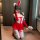 A person wearing a paris bloom bunny girl costume, featuring red and white colors with bunny ears, long gloves, fishnet stock...