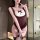 Woman wearing a sexy, tight-fitting plus size bunny costume bodysuit with lace trim and bow detail for adult role play.