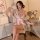 A woman elegantly poses wearing a sheer chiffon japanese kimono-style sleepwear set, featuring a deep v neckline and a cute b...