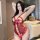 Woman wearing a red plus size lingerie bodysuit with sheer lace, open-crotch design, and adjustable ties.